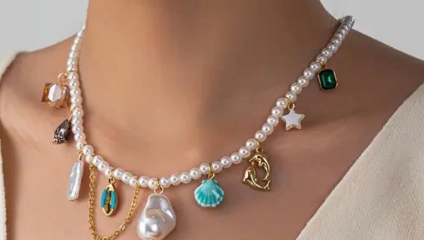 “Ocean Muse Pearl Charm Necklace – Boho Statement Piece”